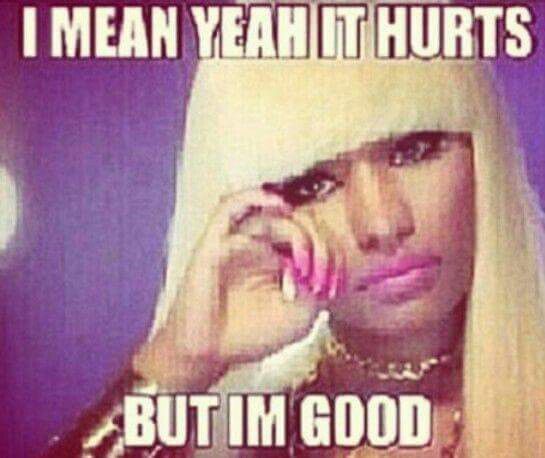 an image of nicki minaj rubbing her eye looking sad, the text, written in impact font meme format reads: I MEAN YEAH IT HURTS BUT IM GOOD